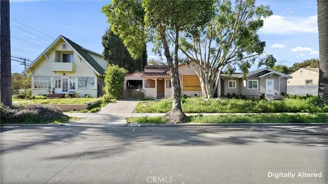 front view of a house next to a yard