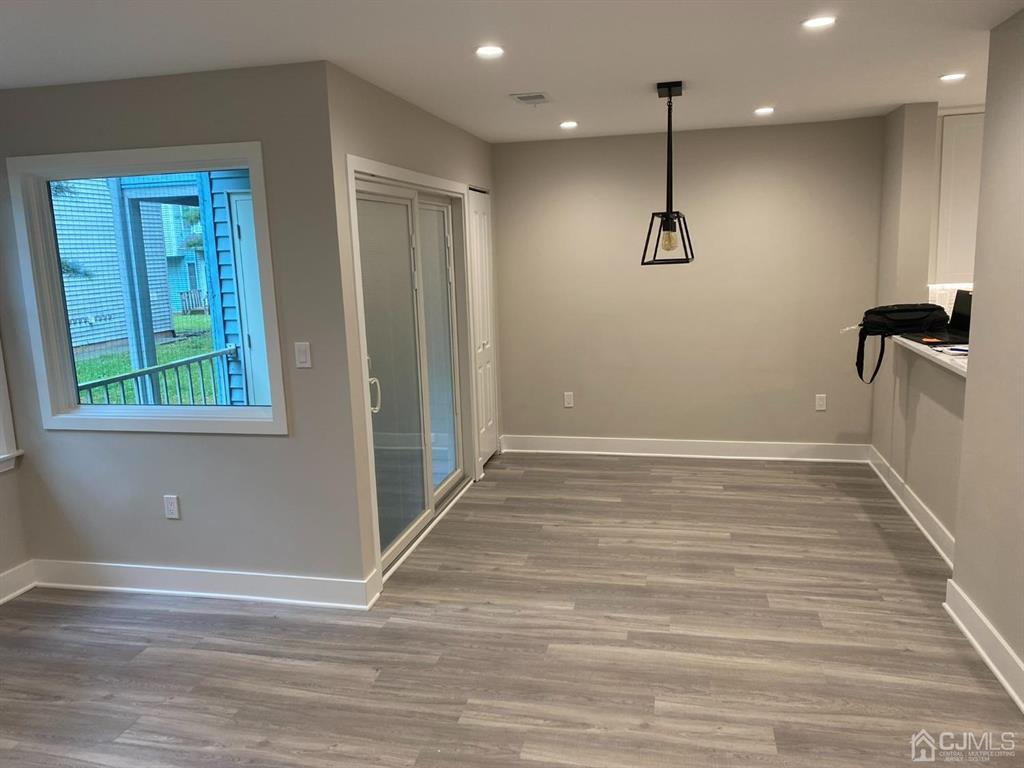 218 Edpas Road New Brunswick, NJ 08901 - Photo 3 of 17 a view of a livingroom with a ceiling fan and window