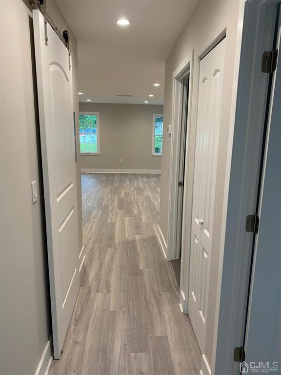 218 Edpas Road New Brunswick, NJ 08901 - Photo 6 of 17 a view of hallway with wooden floor and outdoor space