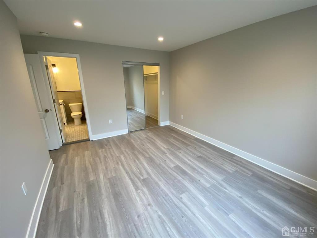218 Edpas Road New Brunswick, NJ 08901 - Photo 10 of 17 a view of empty room with wooden floor