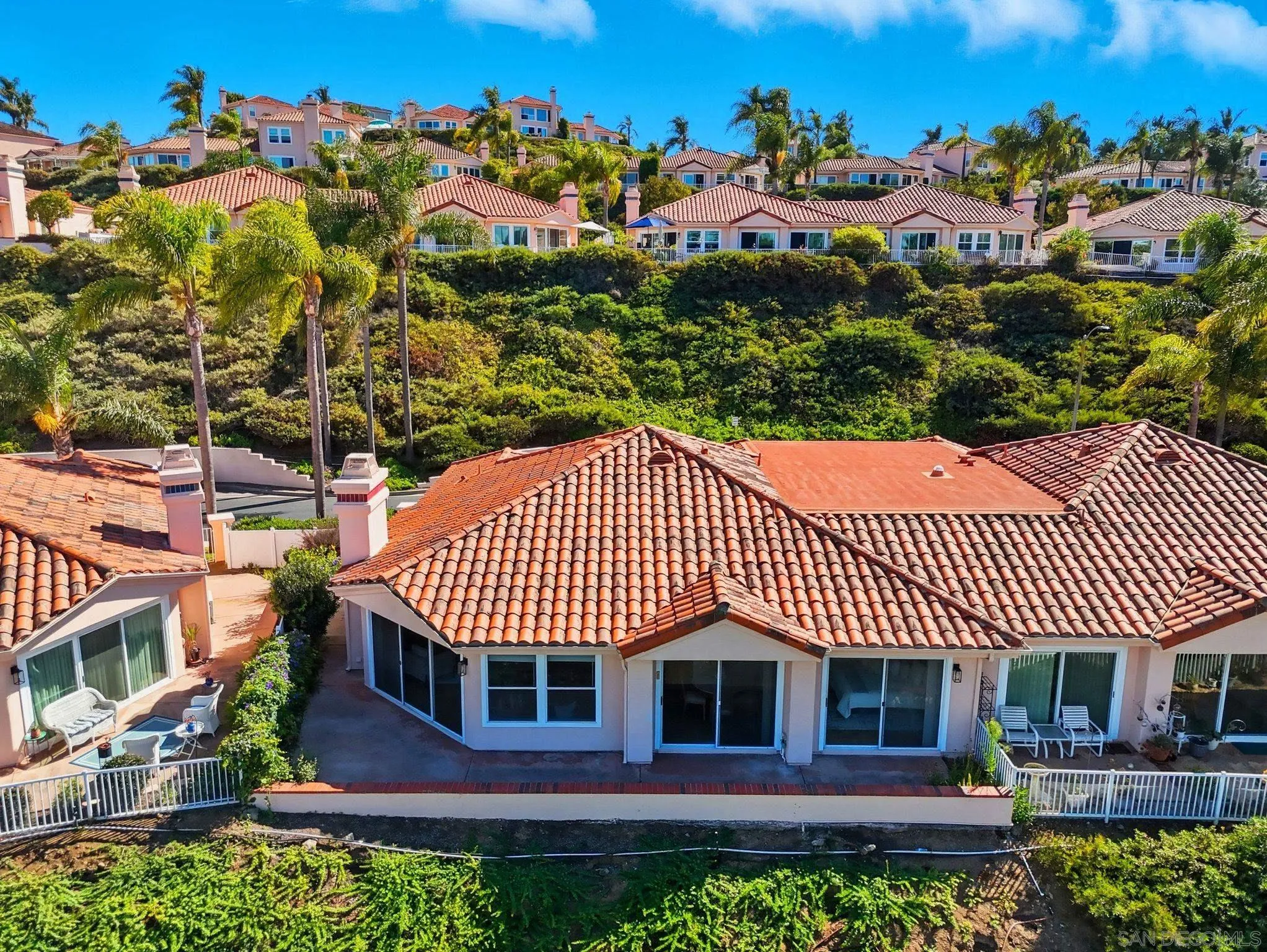 an outdoor view of a house with a garden