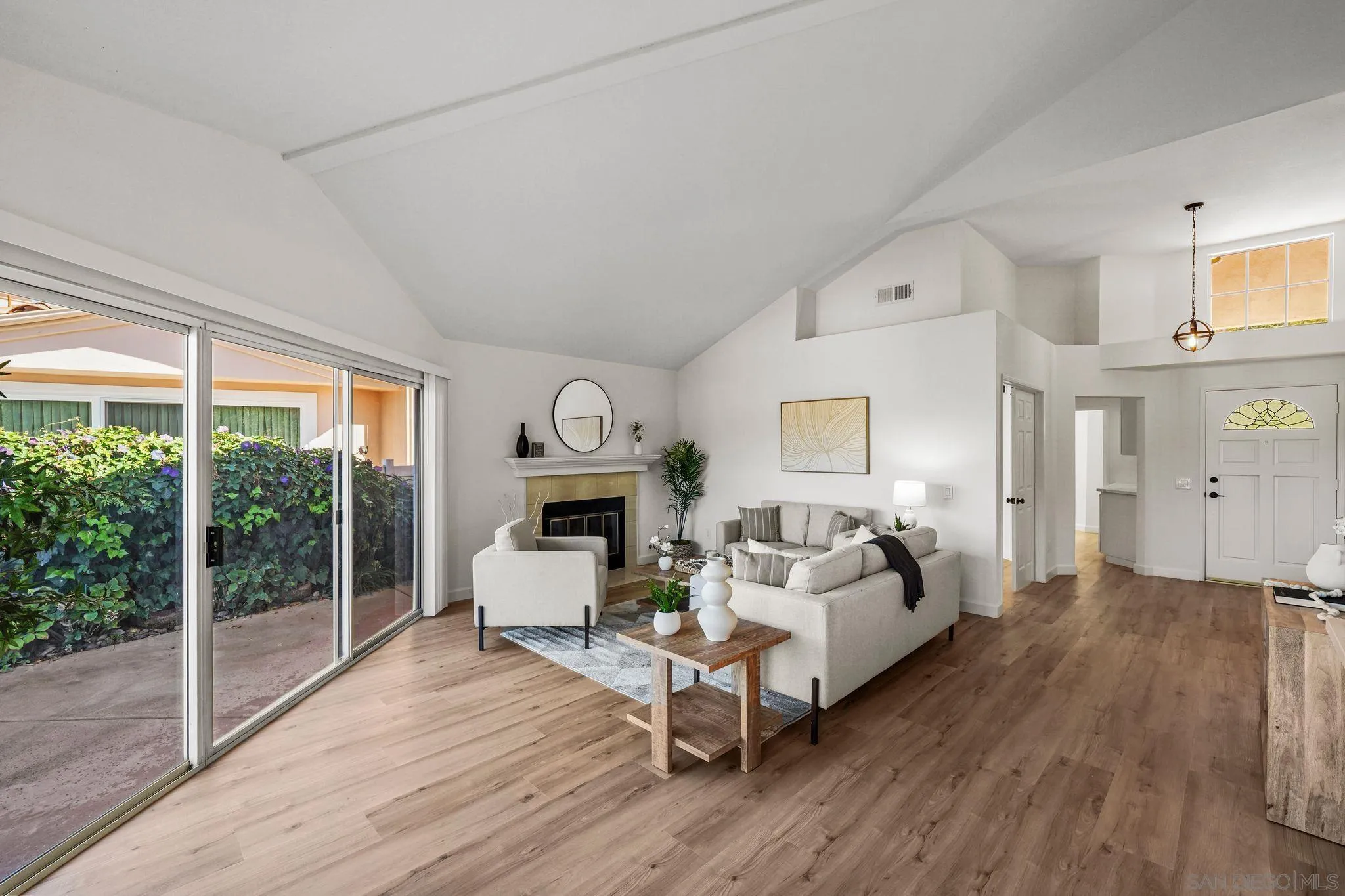 1274 Rue St Moritz San Marcos, CA 92078 - Photo 13 of 39 a living room with furniture a large window and wooden floor