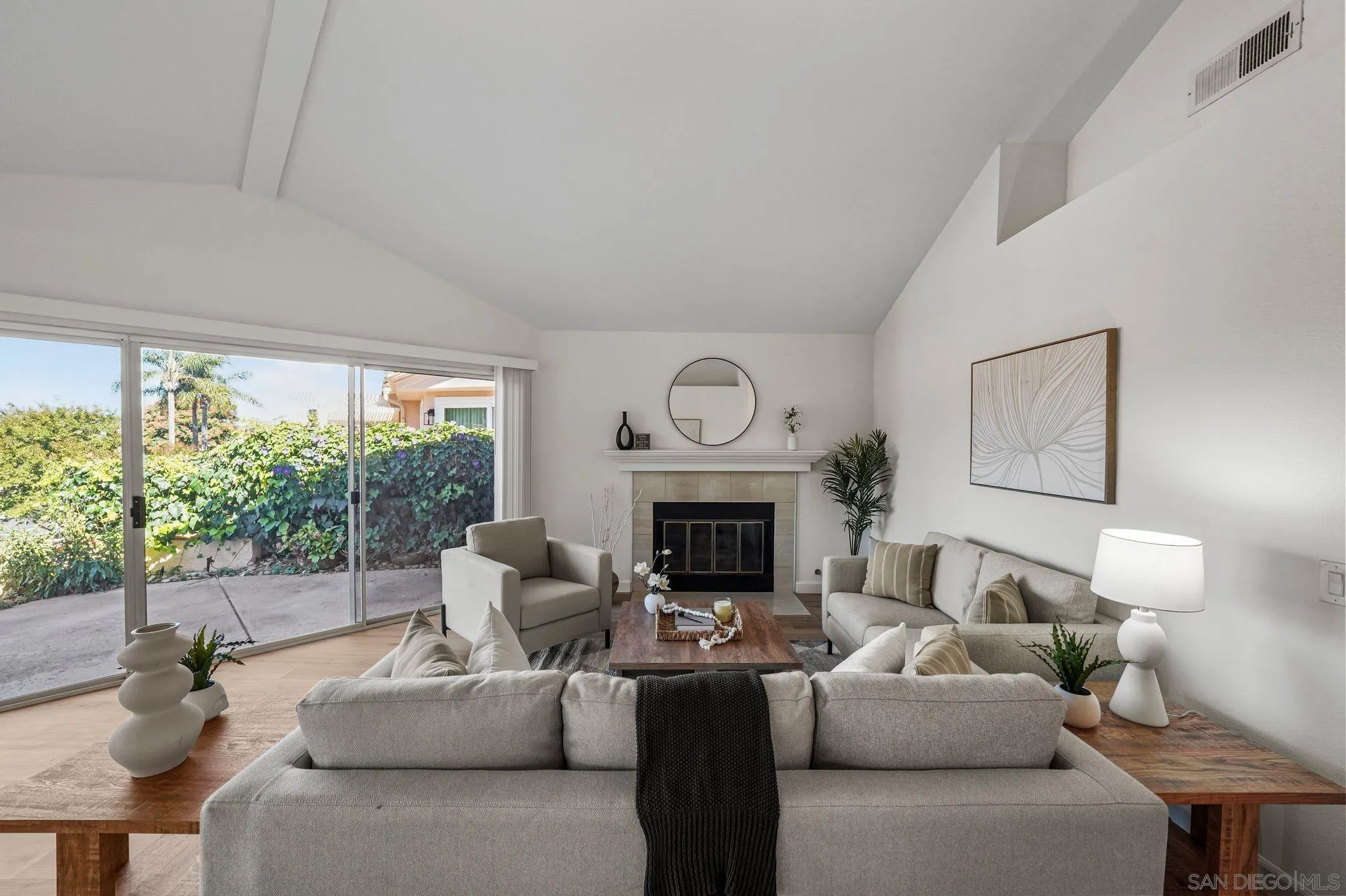 1274 Rue St Moritz San Marcos, CA 92078 - Photo 14 of 39 a living room with furniture a fireplace and a floor to ceiling window