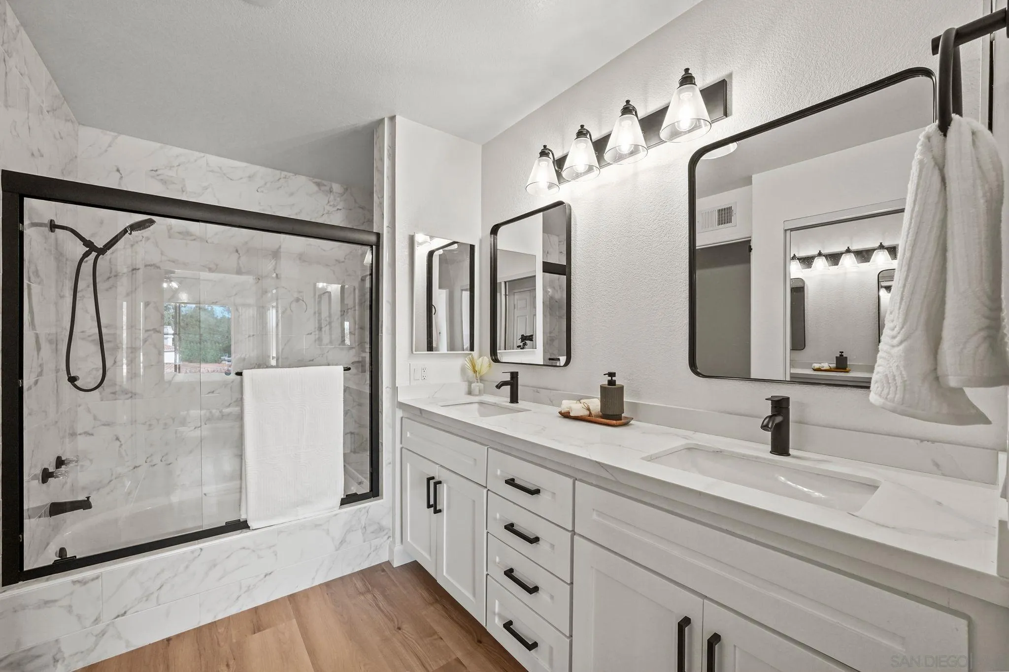 1274 Rue St Moritz San Marcos, CA 92078 - Photo 20 of 39 a bathroom with a double vanity sink mirror and shower