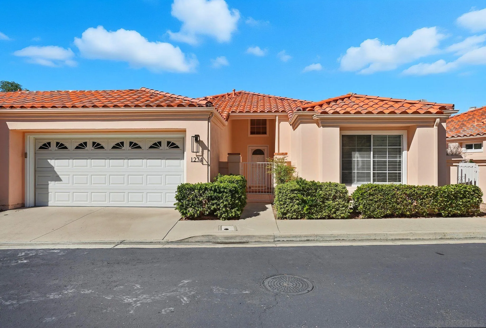 1274 Rue St Moritz San Marcos, CA 92078 - Photo 2 of 39 a front view of a house with a yard