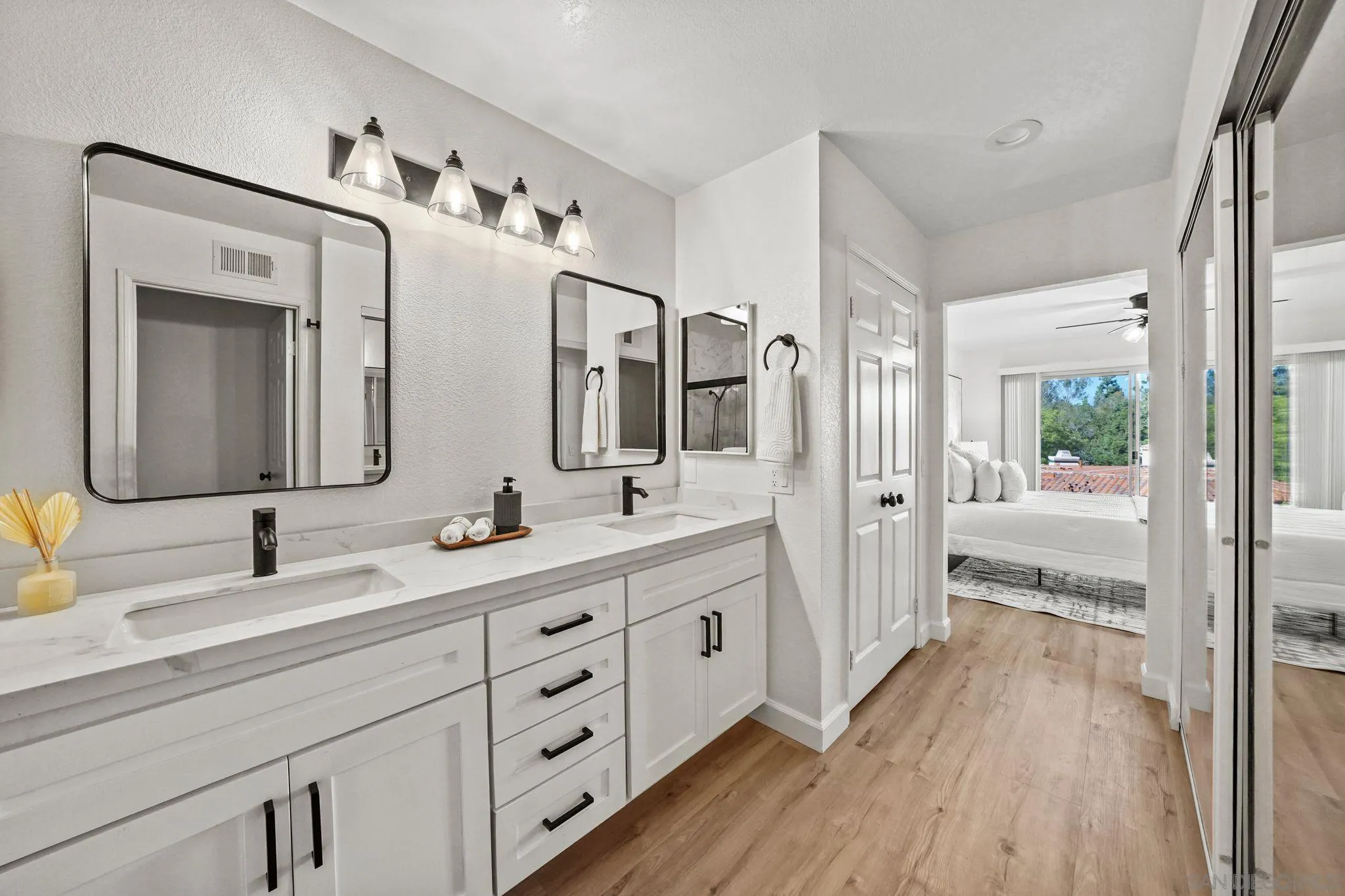 1274 Rue St Moritz San Marcos, CA 92078 - Photo 21 of 39 a bathroom with a double vanity sink and mirror