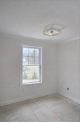 94 Willow Street, Unit 2 Acton, MA 01720 - Photo 14 of 24 an empty room with a window