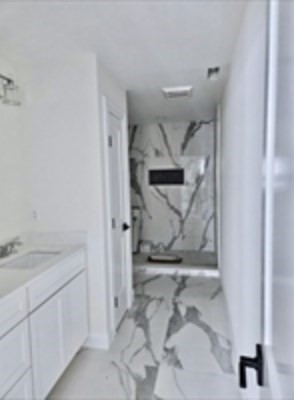 94 Willow Street, Unit 2 Acton, MA 01720 - Photo 15 of 24 a bathroom with a sink and mirror