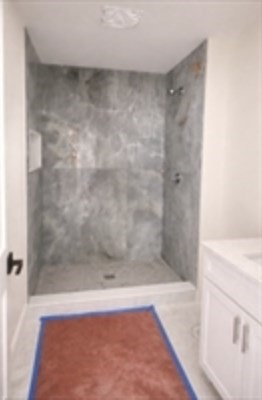 94 Willow Street, Unit 2 Acton, MA 01720 - Photo 16 of 24 a view of a bathtub in a bathroom