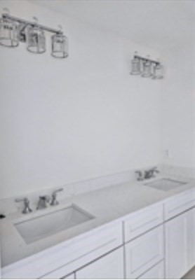 94 Willow Street, Unit 2 Acton, MA 01720 - Photo 19 of 24 a bathroom with a sink and a mirror