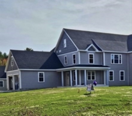 94 Willow Street, Unit 2 Acton, MA 01720 - Photo 2 of 24 a aerial view of a house with a yard