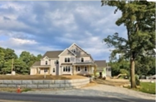 94 Willow Street, Unit 2 Acton, MA 01720 - Photo 21 of 24 a view of multiple houses with a street