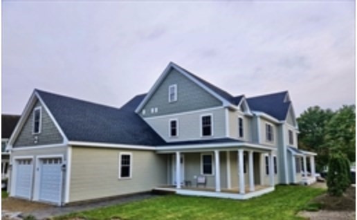 94 Willow Street, Unit 2 Acton, MA 01720 - Photo 3 of 24 a front view of a house with a yard