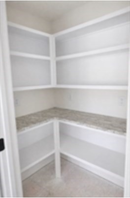 94 Willow Street, Unit 2 Acton, MA 01720 - Photo 5 of 24 a view of walk in closet with empty racks