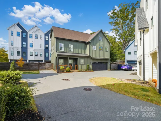 a view of a house with swimming pool and sitting area