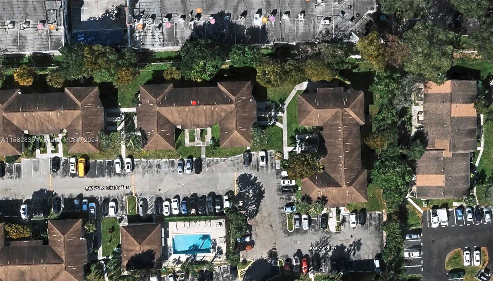 an aerial view of houses with outdoor space