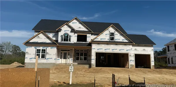 a view of house with yard