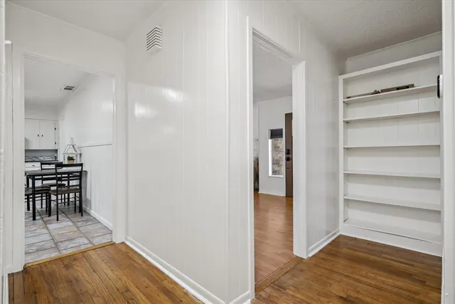 a view of kitchen with furniture and wooden floor