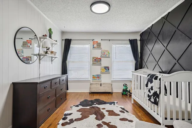 a bathroom with a bathtub and a mirror