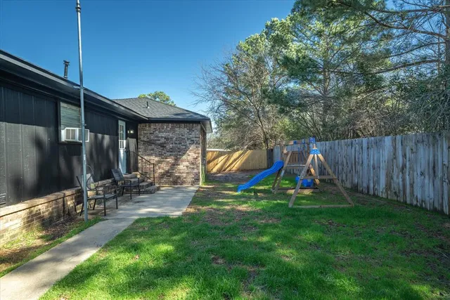 a view of a backyard with a slide