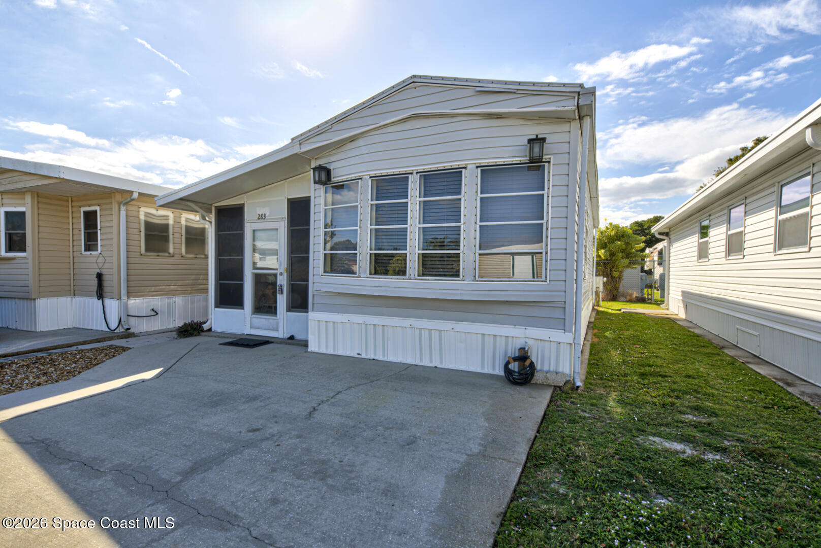 283 Buffalo Place Rockledge, FL 32955 - Photo 2 of 23 a front view of a house with a yard