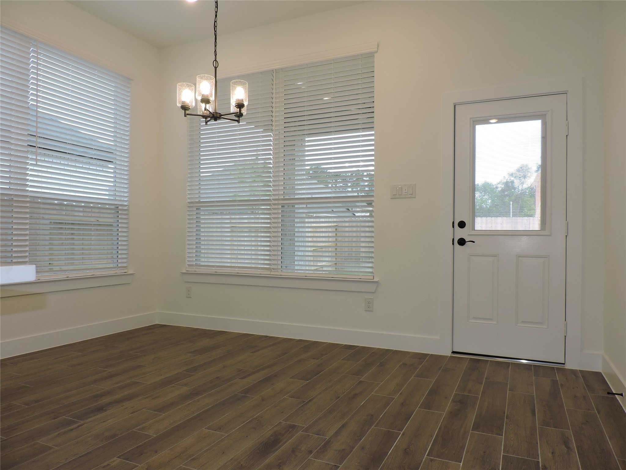 12853 Meadow Wind Way Conroe, TX 77302 - Photo 16 of 34 Large Dining area with access to fenced backyard with large covered patio