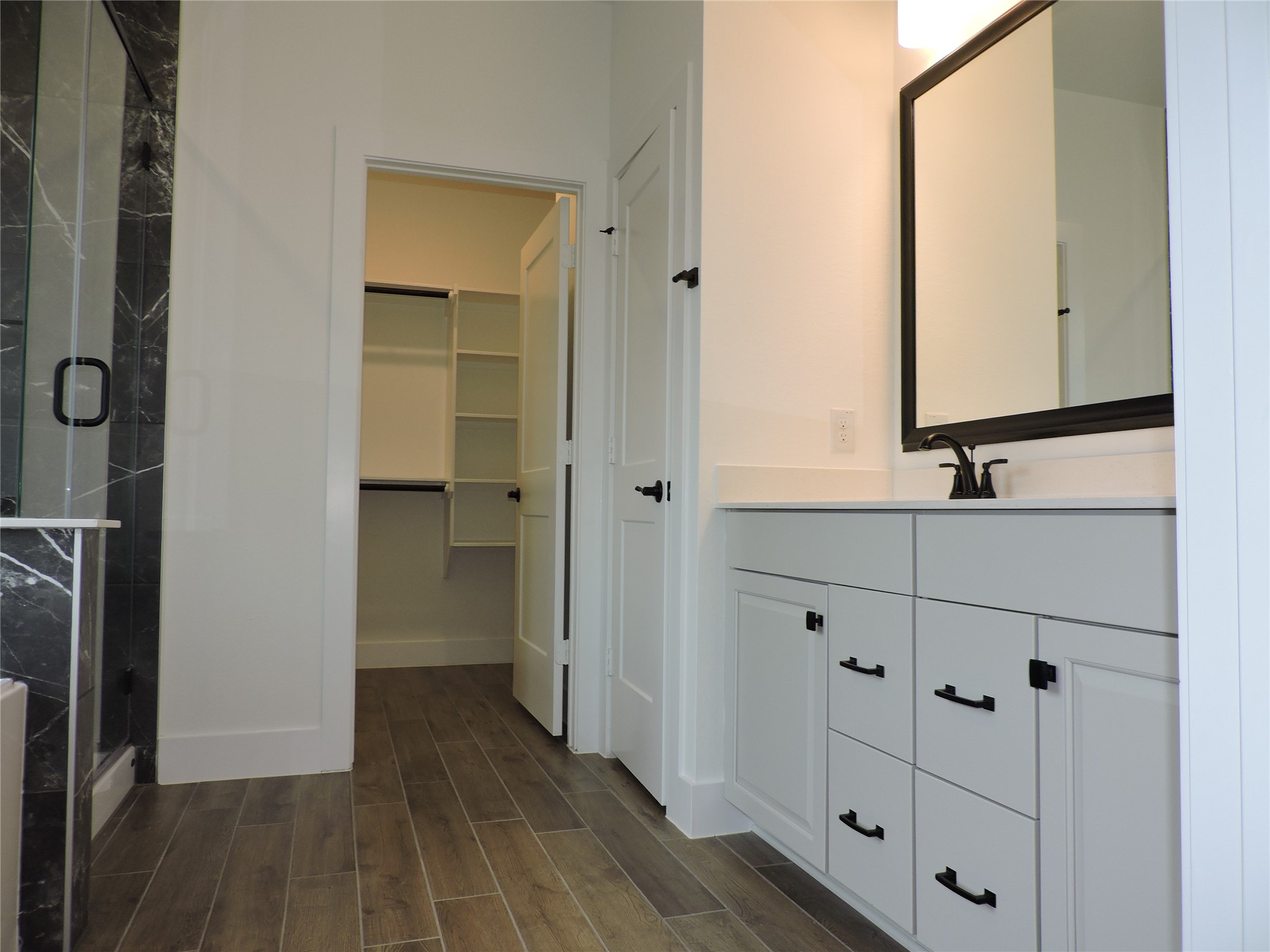 12853 Meadow Wind Way Conroe, TX 77302 - Photo 20 of 34 Primary bath features dual vanity with very spacious walk in closet.