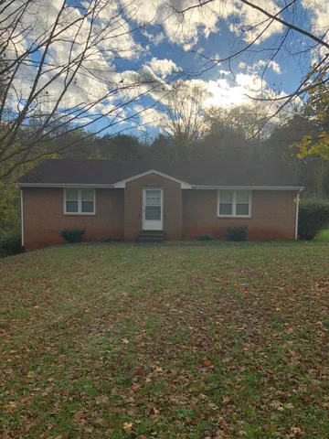 a view of house with an outdoor space