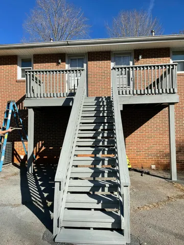 a view of a balcony with wooden floor