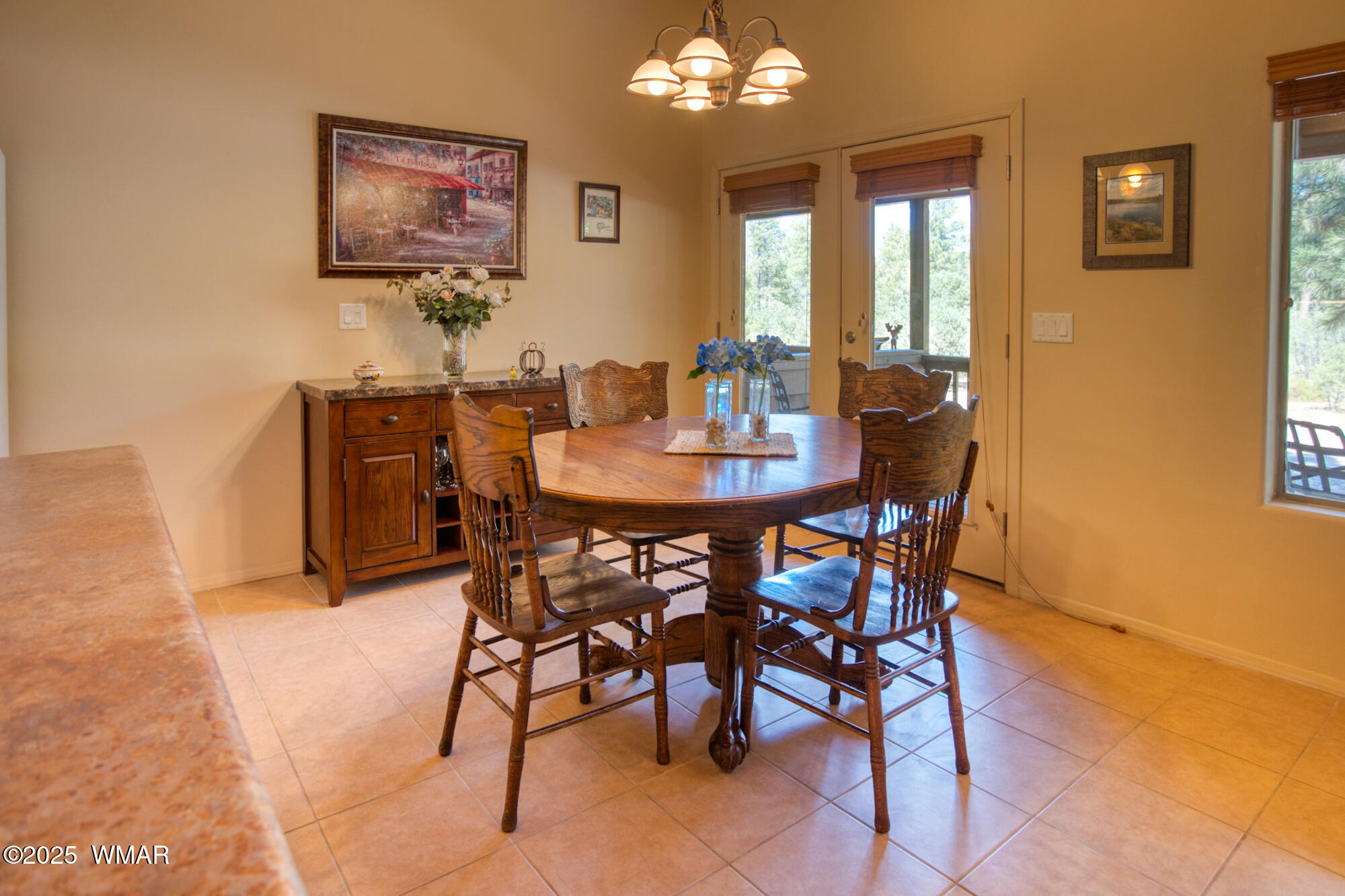 6214 West Starlight Ridge Parkway Lakeside, AZ 85929 - Photo 11 of 28 The dining area is just steps from the kitchen, but offers views the covered rear deck.