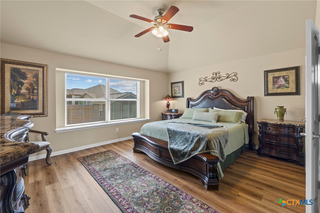 20525 Jackies Ranch Boulevard Pflugerville, TX 78660 - Photo 13 of 30 Bedroom featuring light wood-style floors, ceiling fan, and lofted ceiling