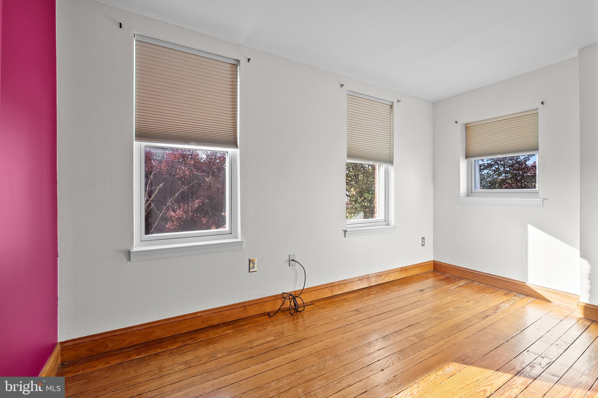 2200 East Baltimore Street Baltimore, MD 21231 - Photo 14 of 24 a view of an empty room with wooden floor and a window