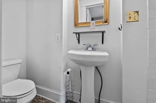 a bathroom with a sink toilet