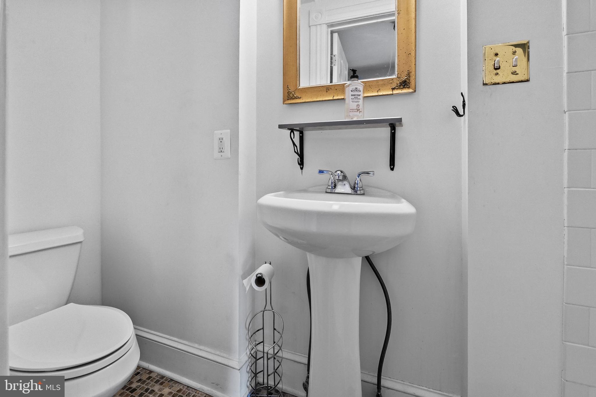 2200 East Baltimore Street Baltimore, MD 21231 - Photo 16 of 24 a bathroom with a sink toilet