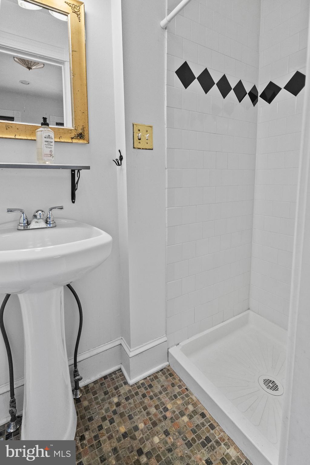 2200 East Baltimore Street Baltimore, MD 21231 - Photo 17 of 24 a bathroom with a sink a toilet and a mirror