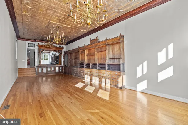a view of an entryway with wooden floor