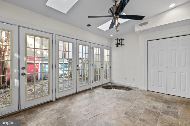 a view of an empty room with windows