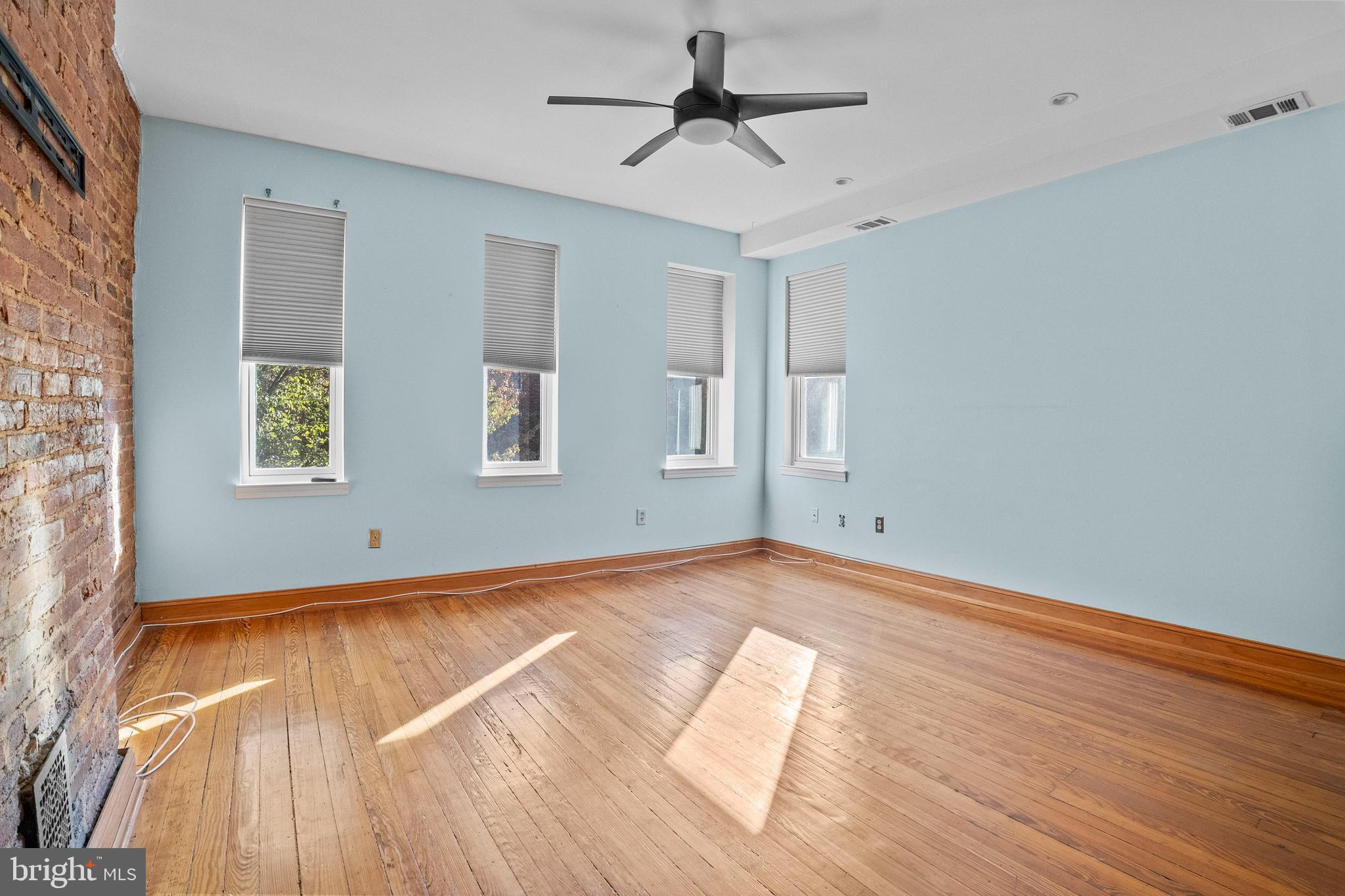 2200 East Baltimore Street Baltimore, MD 21231 - Photo 10 of 24 a view of empty room with wooden floor and fan