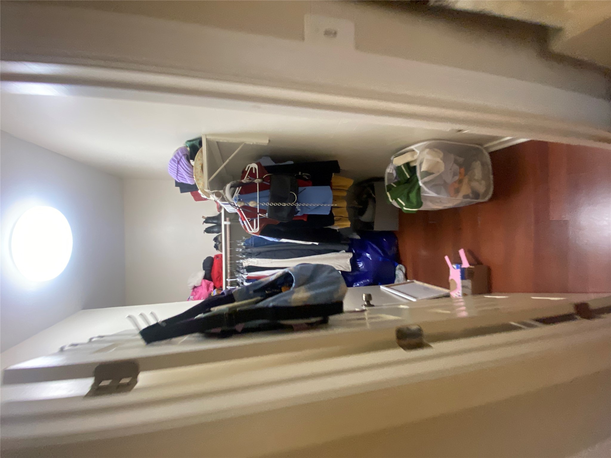 3010 Fruth Street, Unit A Austin, TX 78705 - Photo 21 of 39 Recessed closet with wood-finish flooring, built-in shelving, and a flush-mount ceiling light fixture