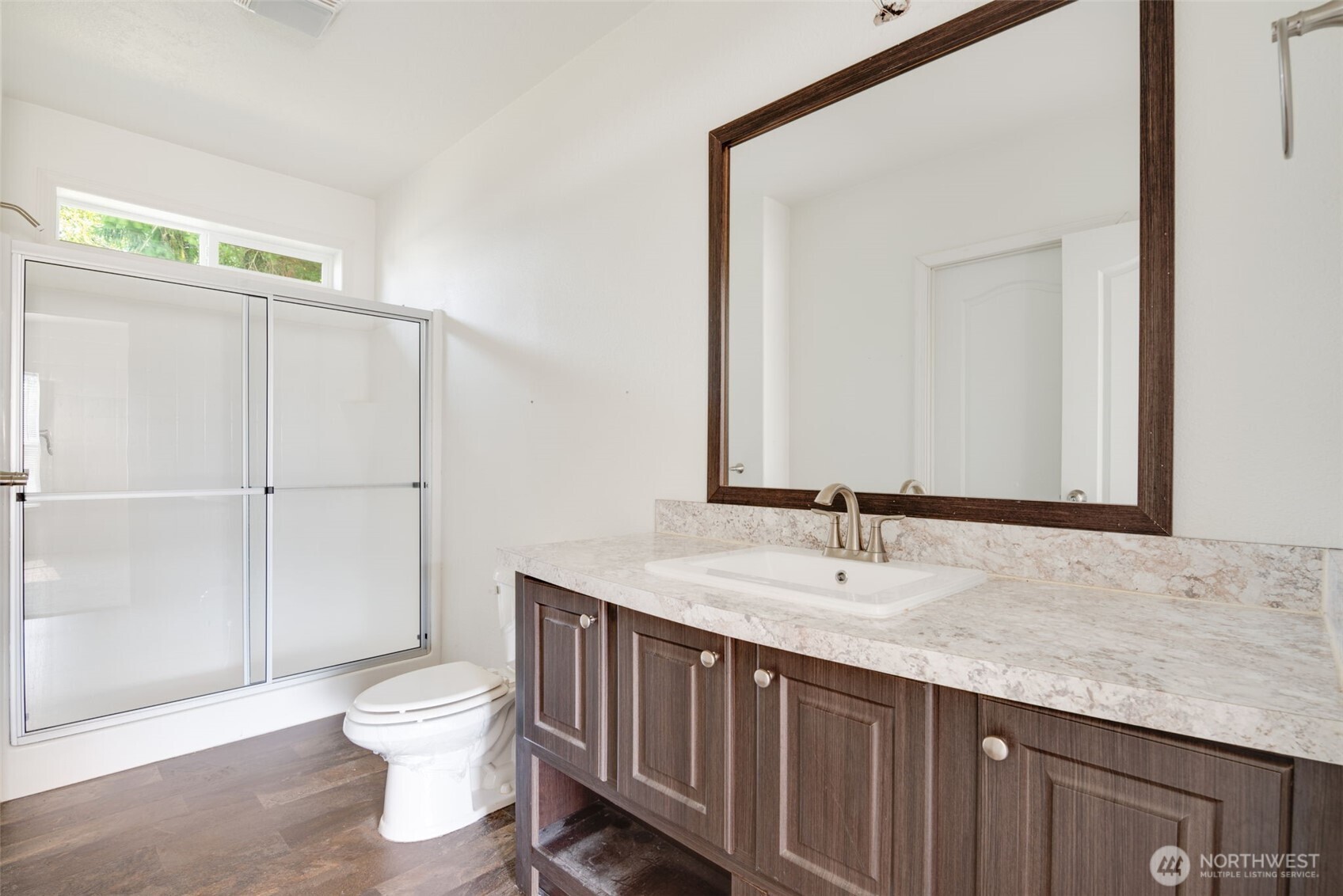 4322 Ocean Beach Highway Longview, WA 98632 - Photo 22 of 40 a bathroom with a granite countertop sink and a mirror