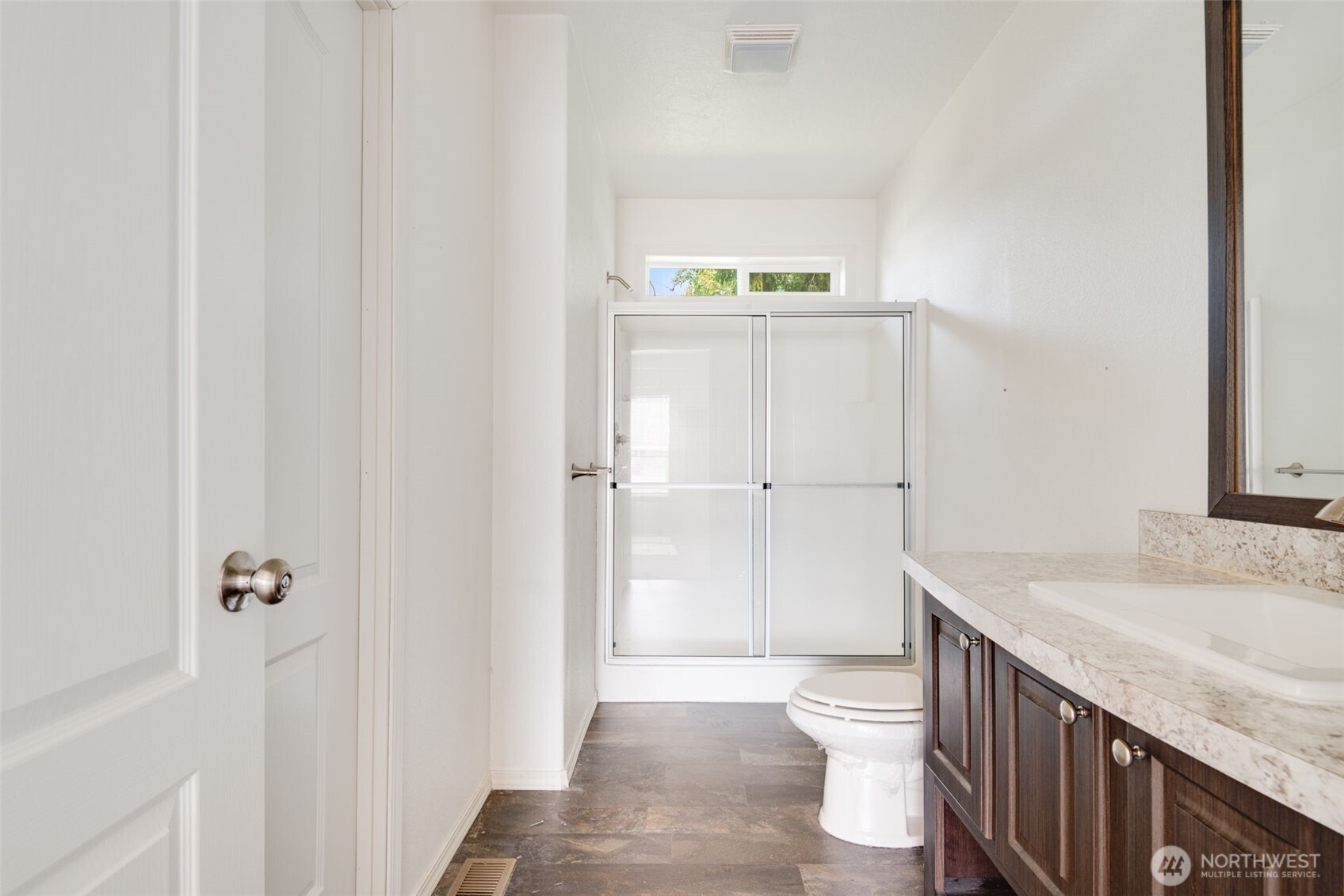 4322 Ocean Beach Highway Longview, WA 98632 - Photo 23 of 40 a bathroom with a granite countertop sink toilet and shower