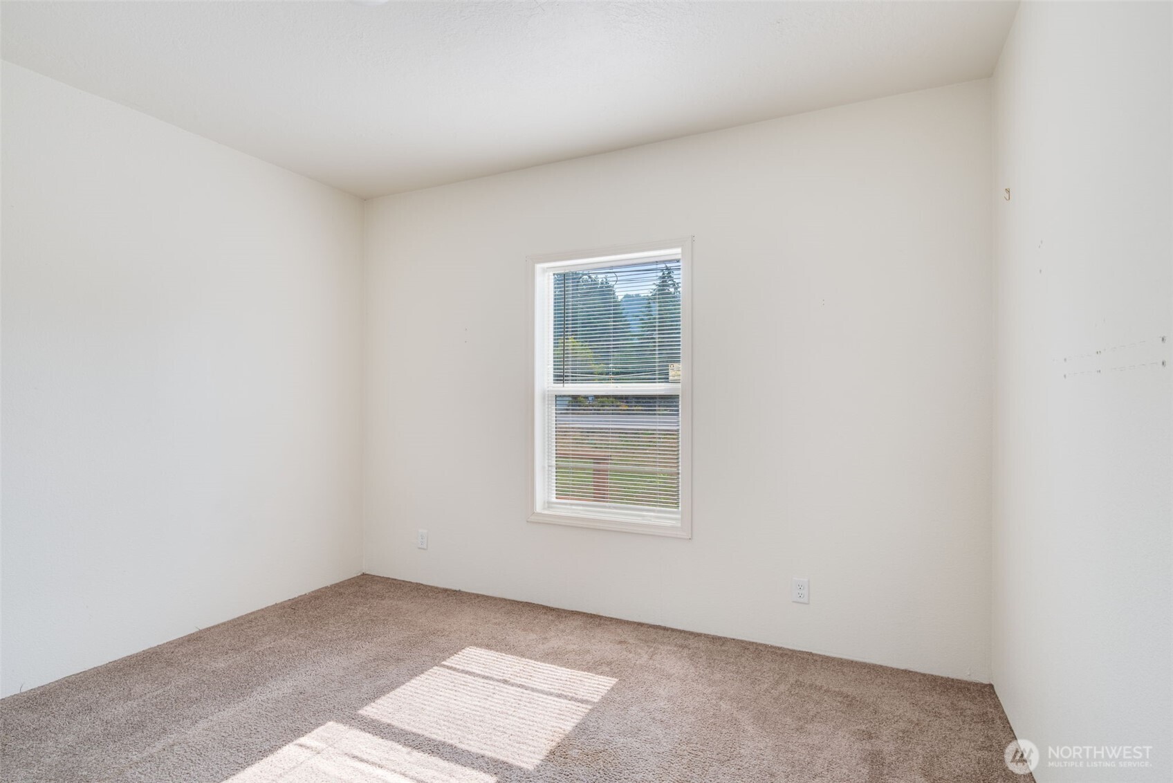 4322 Ocean Beach Highway Longview, WA 98632 - Photo 26 of 40 an empty room with a window