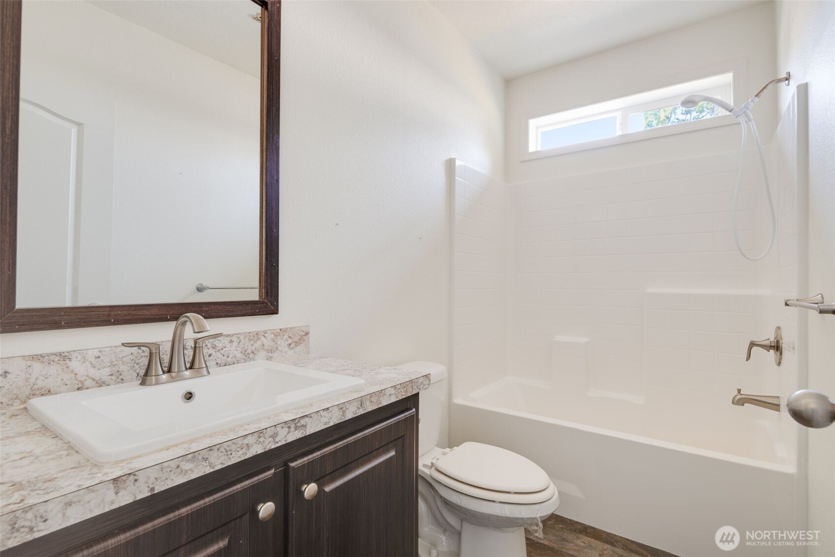 4322 Ocean Beach Highway Longview, WA 98632 - Photo 29 of 40 a bathroom with a granite countertop sink a toilet and a bathtub