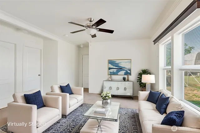 a living room with furniture and a large window