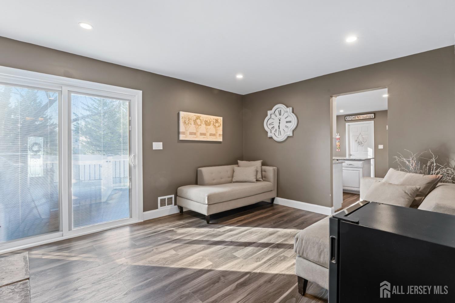4 Whitman Road Morganville, NJ 07751 - Photo 16 of 45 a living room with furniture and a table