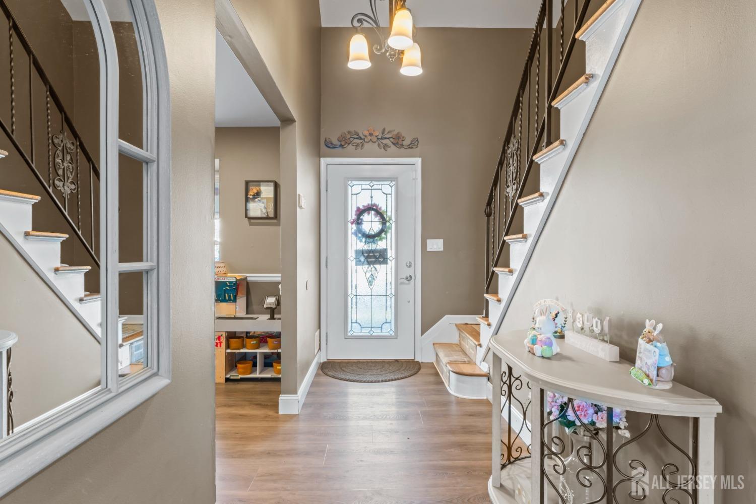4 Whitman Road Morganville, NJ 07751 - Photo 17 of 45 a view of an entryway with wooden floor and windows