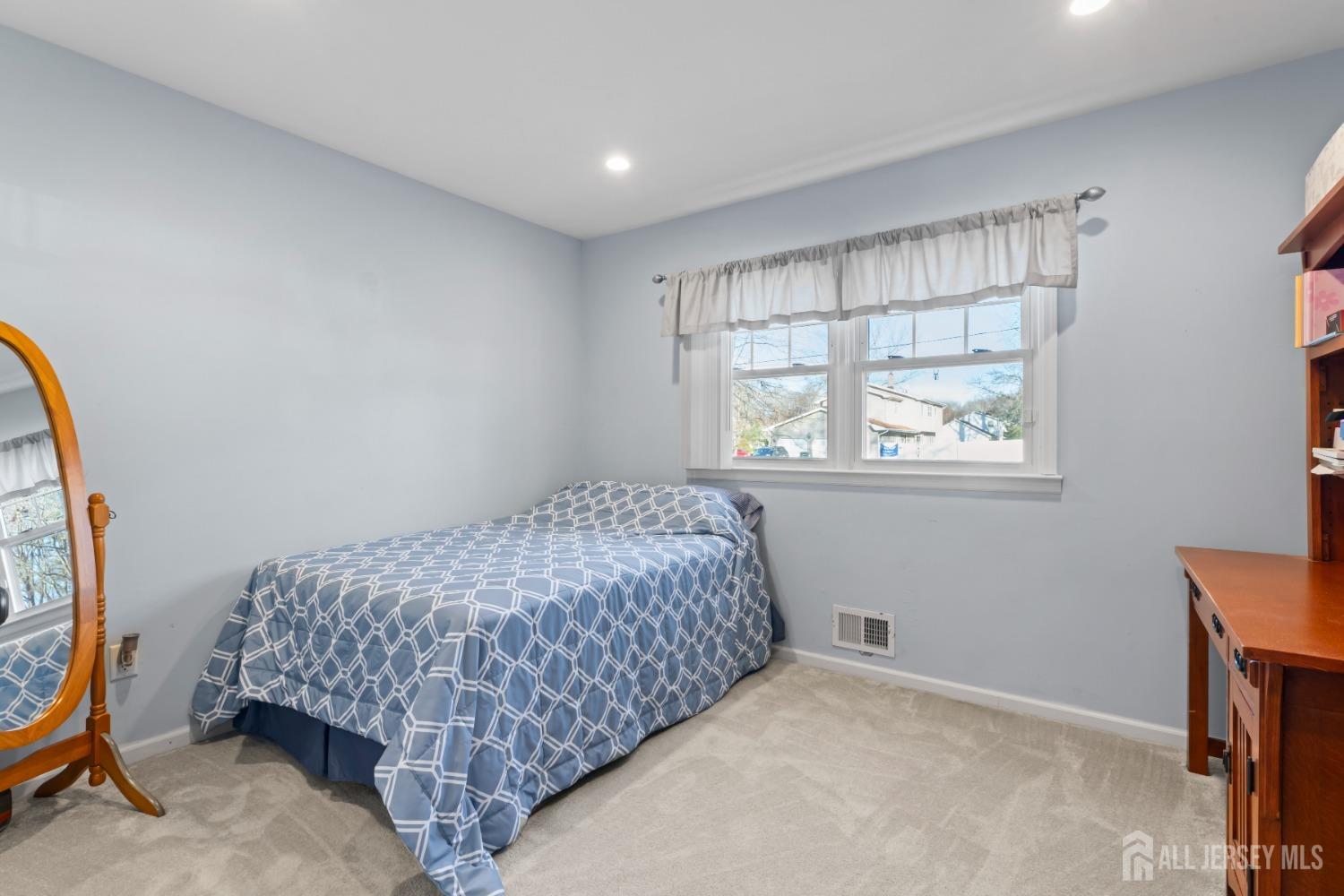 4 Whitman Road Morganville, NJ 07751 - Photo 24 of 45 a bedroom with a bed and a window