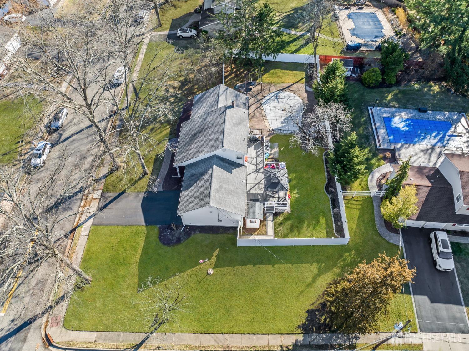 4 Whitman Road Morganville, NJ 07751 - Photo 37 of 45 an aerial view of a house with outdoor space