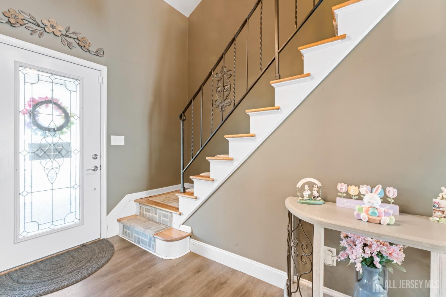 4 Whitman Road Morganville, NJ 07751 - Photo 5 of 45 a view of entryway and hall with wooden floor