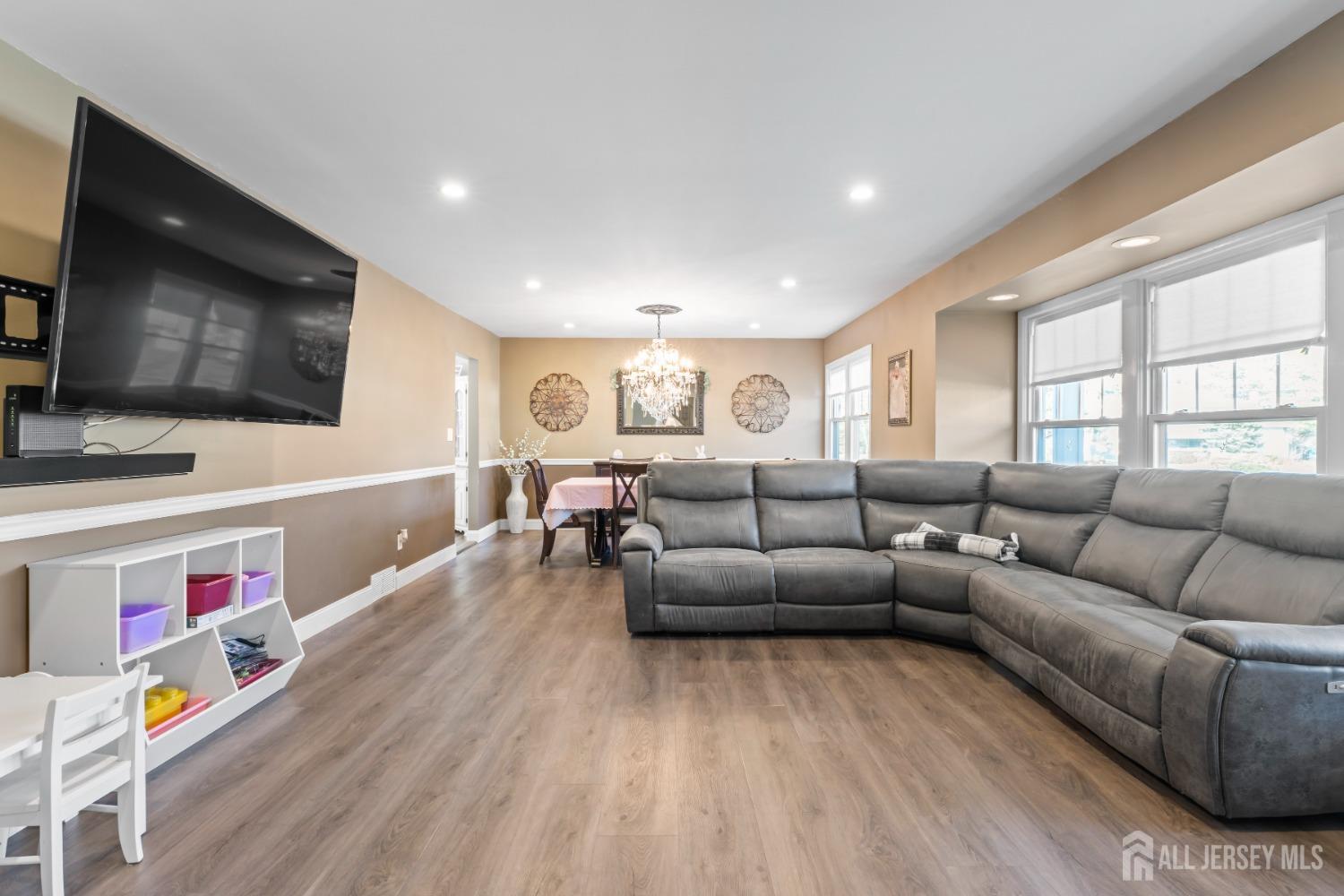 4 Whitman Road Morganville, NJ 07751 - Photo 6 of 45 a living room with furniture and a flat screen tv
